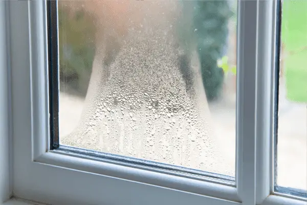 Misted double glazed window unit with condensation between the panes
