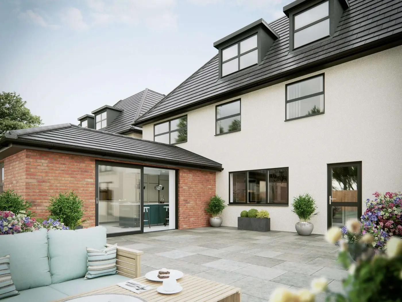 Modern home extension with aluminium sliding doors and a patio
